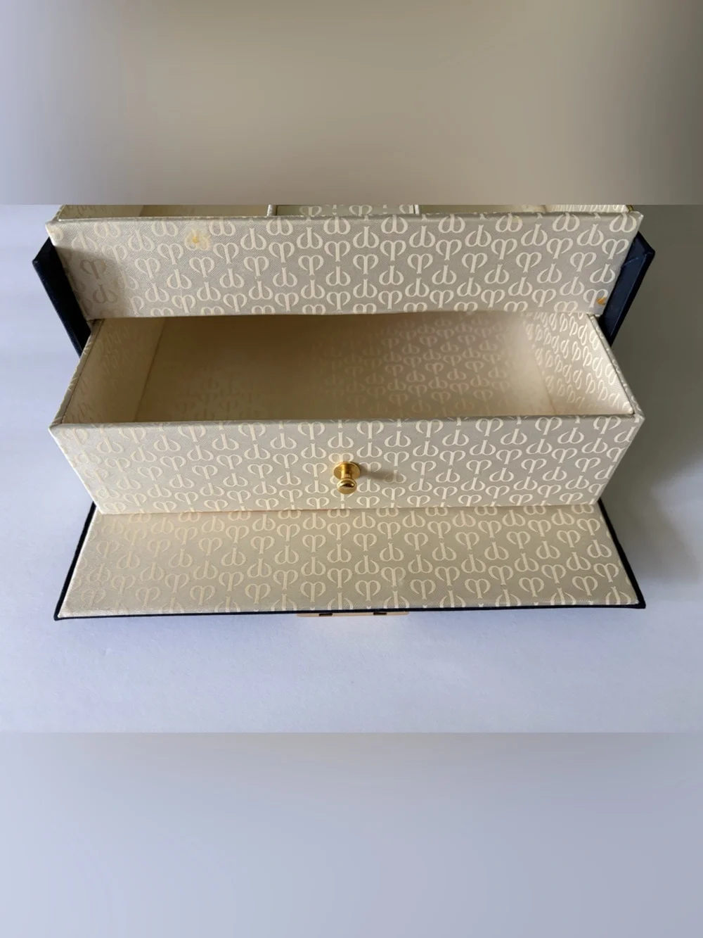 NWOT Cle’ de Peau elegant blue satin small/travel jewelry box. Mirror. Drawer